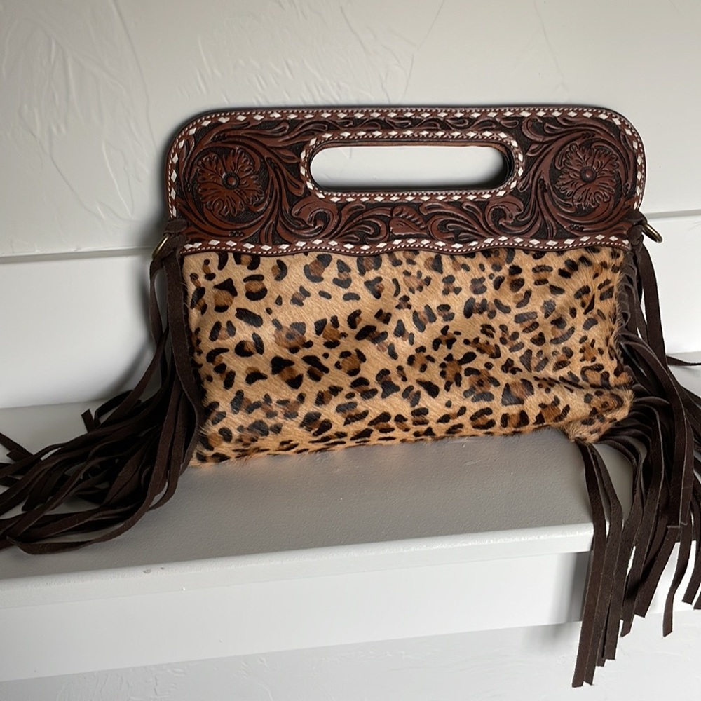 Leather and leopard crossbody and clutch.